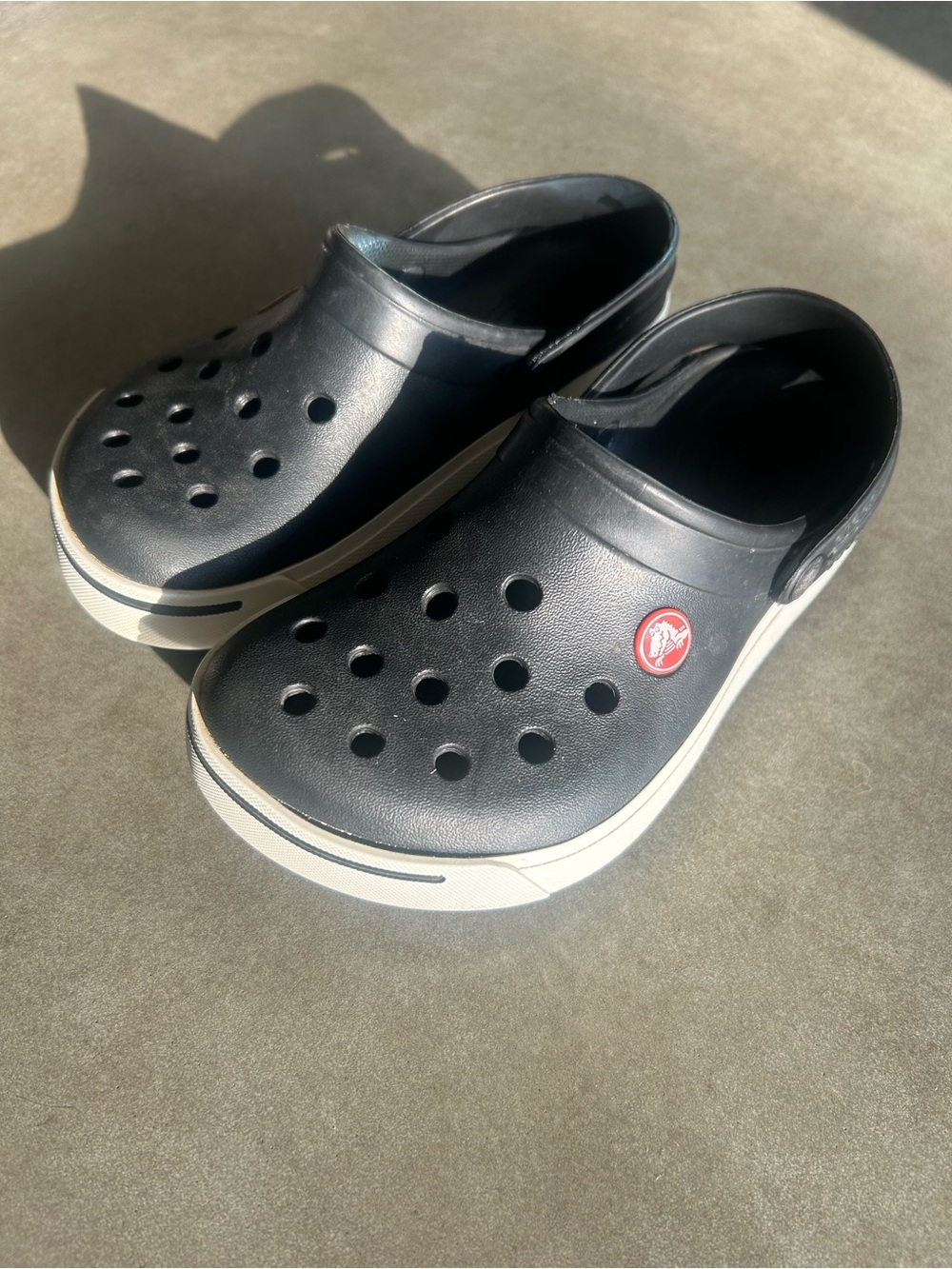 Kids Black Slip-On CROC Clog Sandals with White Trim. Crocband crocs.